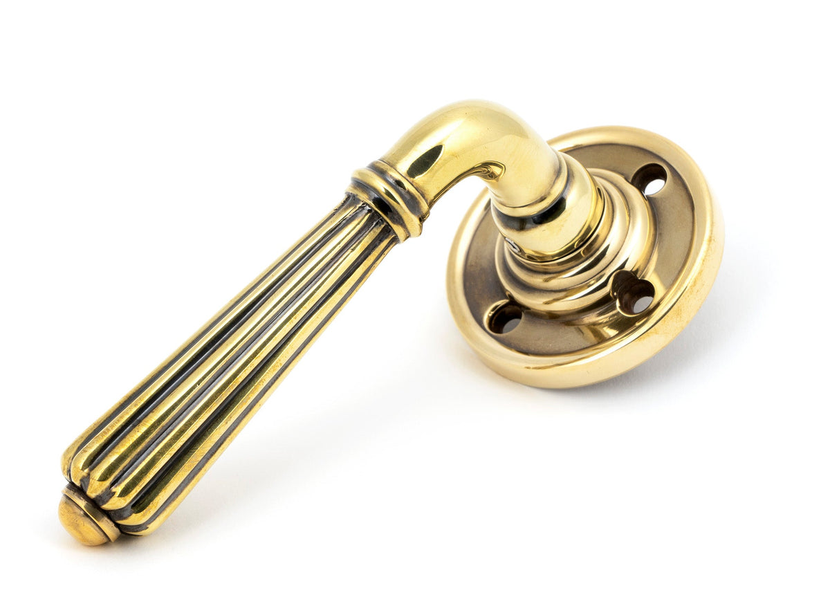 From The Anvil's Aged Brass Hinton Lever on Rose Set (Sprung)