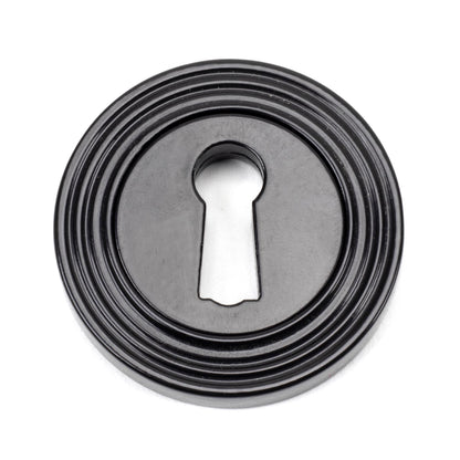 From The Anvil's Black Round Escutcheon