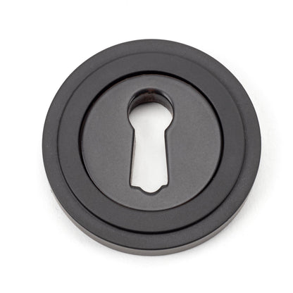 From The Anvil's Aged Bronze Round Escutcheon