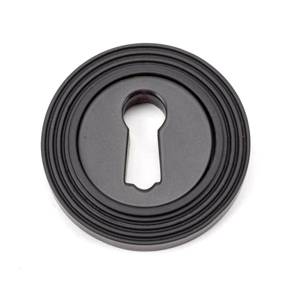 From The Anvil's Aged Bronze Round Escutcheon