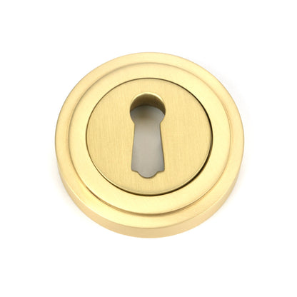 From The Anvil's Satin Brass Round Escutcheon