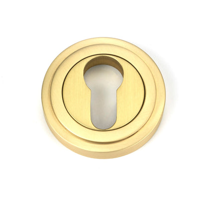 From The Anvil's Satin Brass Round Euro Escutcheon