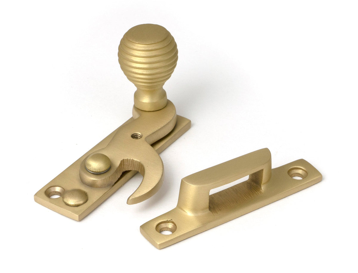 From The Anvil's Satin Brass Beehive Sash Hook Fastener