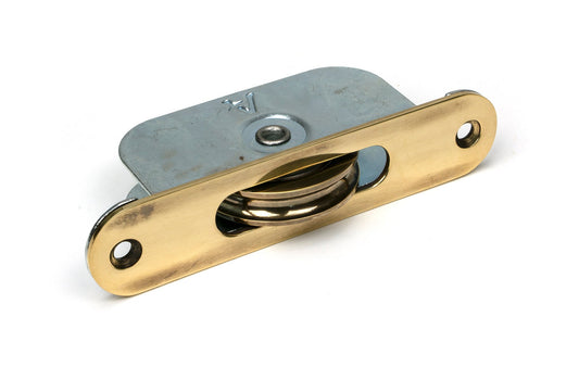 From The Anvil's Aged Brass Radiused Sash Pulley 75kg
