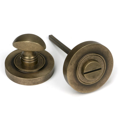From The Anvil's Burnished Brass Concealed Round Thumbturn Set