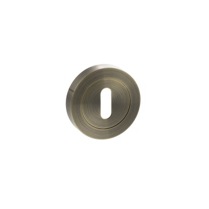 STATUS Key Escutcheons on Round Rose - Antique Brass - Depth: 10mm, Height: 51mm, Width: 51mm