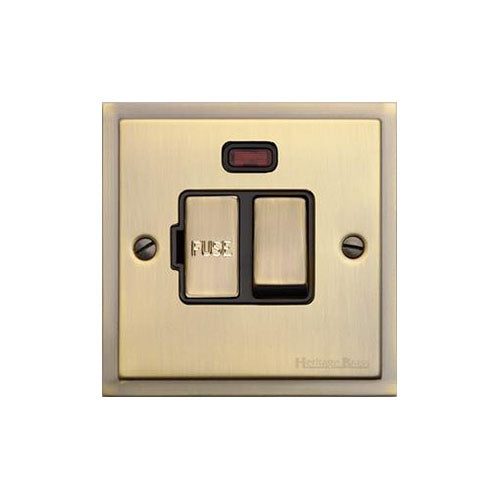 Elite Stepped Plate Range Antique Brass Switches & Sockets, S91 - Switched Spur with Neon (13 Amp) by Heritage Brass By M-Marcus