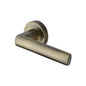 Poseidon Door Handle on Round Rose by M Marcus - Heritage Brass